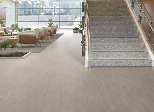 Gray rigid core luxury vinyl flooring in commercial setting