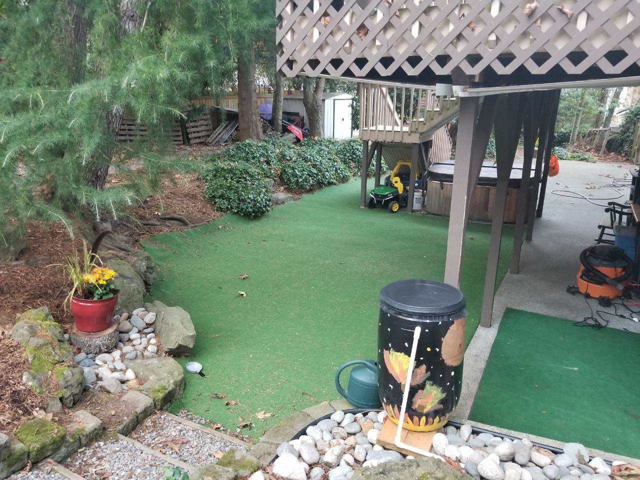 Customer review image of  in back yard under my deck and pine trees